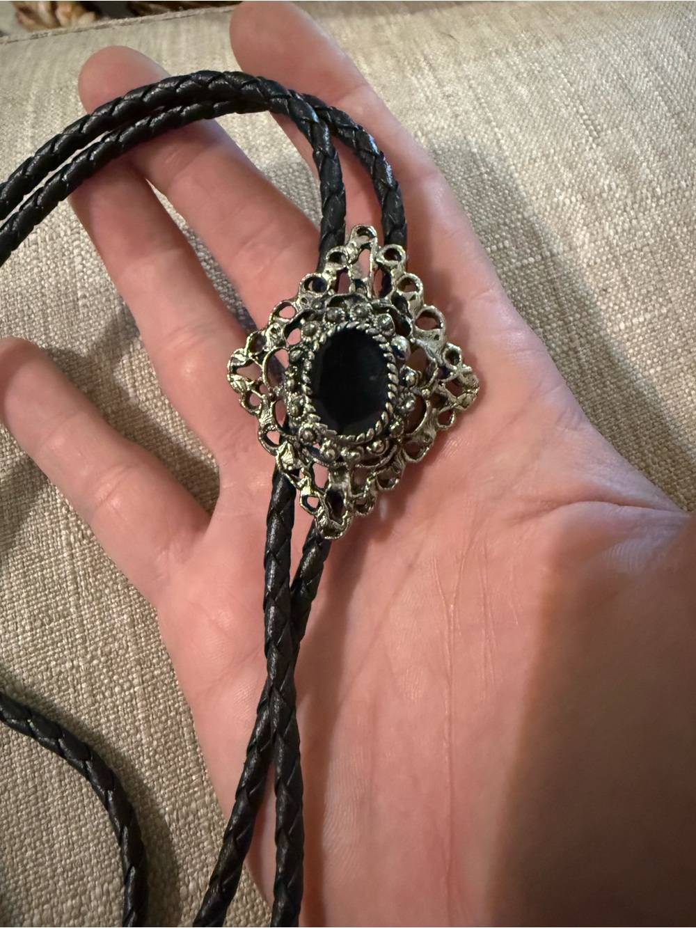 Vintage Black Braided Leather Bolo Tie with Ornate Silver-Tone Medallion